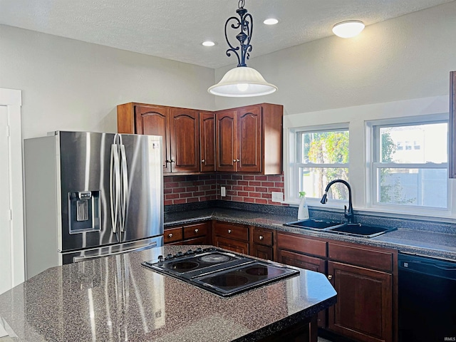 kitchen with black dishwasher, stovetop, sink, hanging light fixtures, and stainless steel fridge with ice dispenser