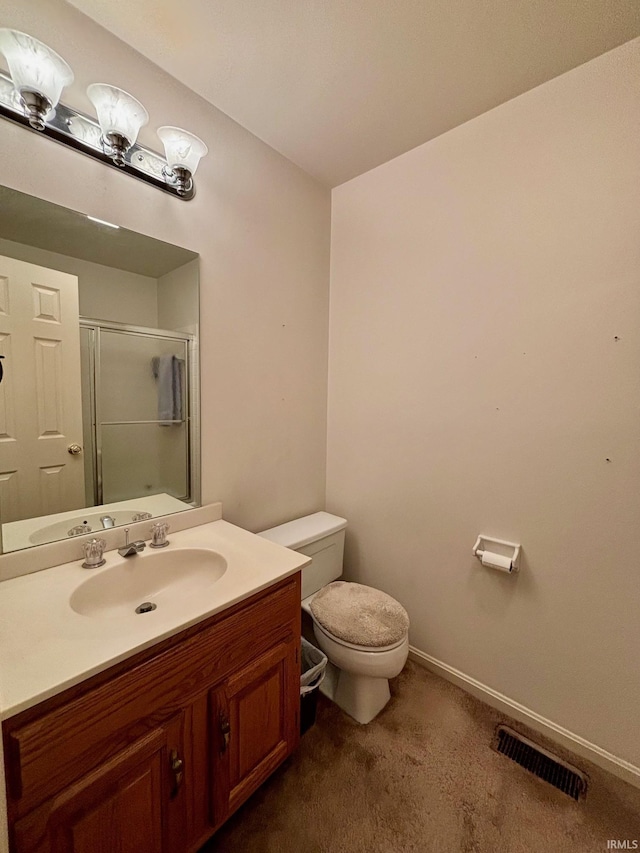 full bath featuring visible vents, toilet, a shower stall, vanity, and baseboards