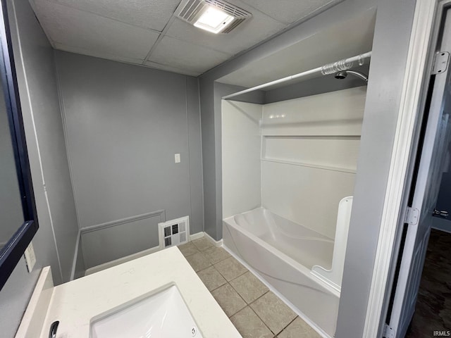 bathroom featuring bathtub / shower combination, tile patterned floors, and vanity