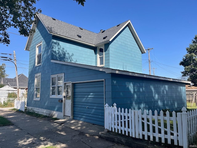 view of side of property featuring a garage