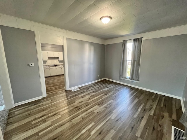 empty room featuring dark hardwood / wood-style floors