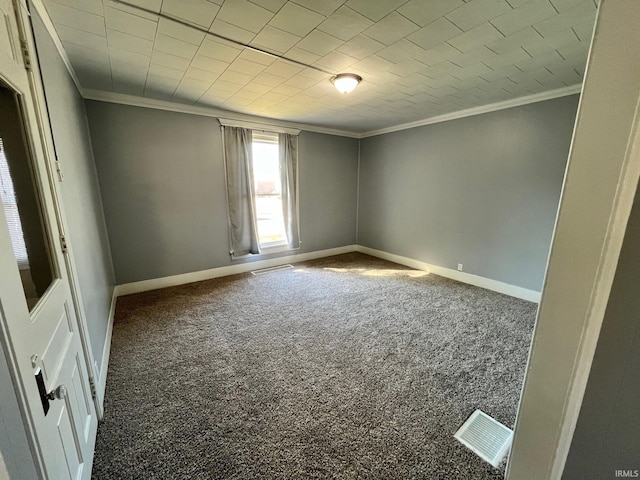 spare room with crown molding and carpet