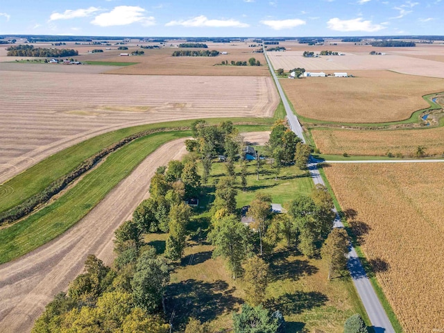 birds eye view of property featuring a rural view