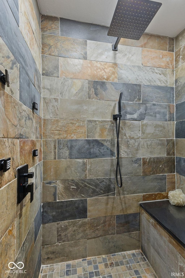 bathroom featuring tiled shower