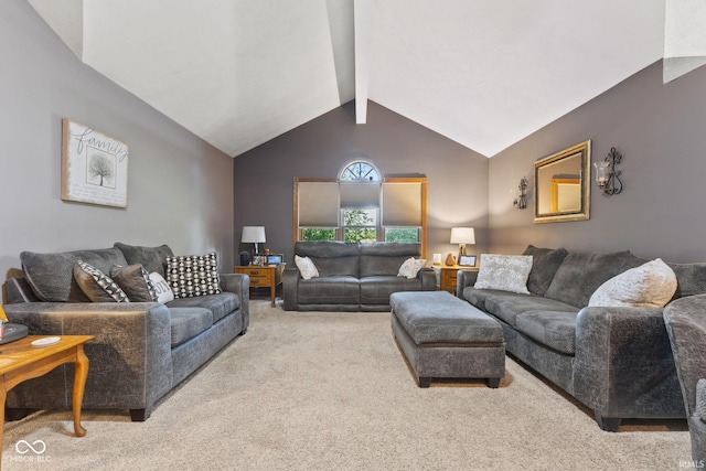 carpeted living room featuring lofted ceiling with beams