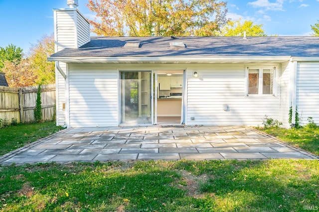 back of property featuring a patio