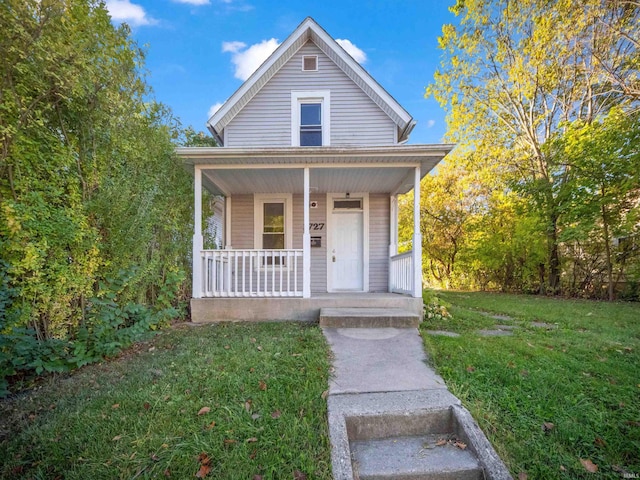 bungalow-style home with a porch and a front yard