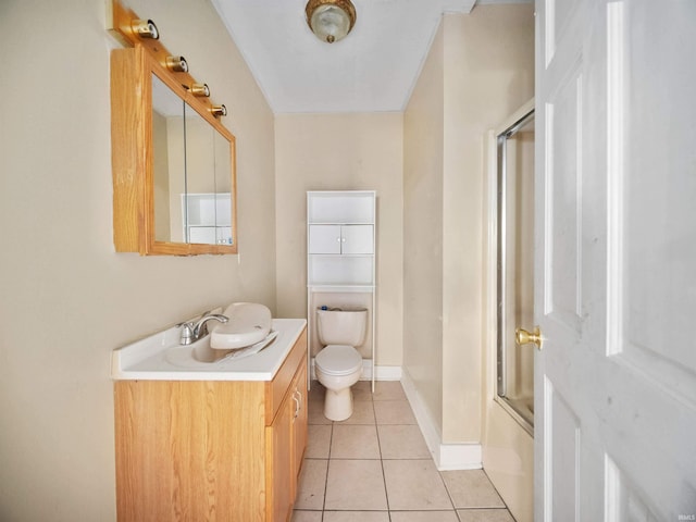 full bathroom featuring shower / bath combination with glass door, vanity, toilet, and tile patterned floors