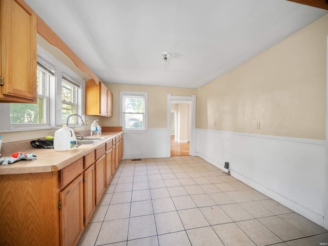 kitchen featuring sink and light tile patterned floors