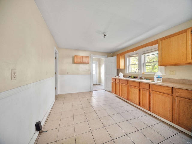 kitchen with sink and light tile patterned floors