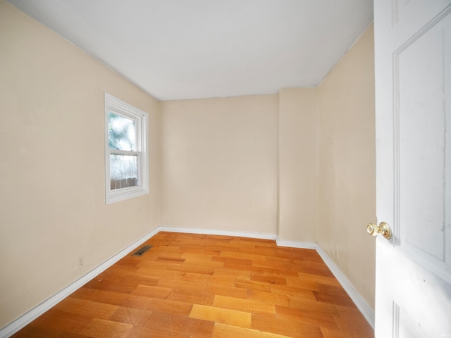 spare room with light wood-type flooring