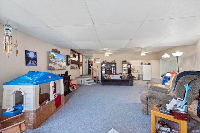 carpeted living room featuring a paneled ceiling and ceiling fan