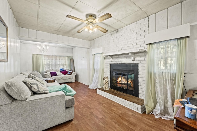 6885 N 315 E, Howe, IN 46746 - living room with a fireplace, ceiling fan with notable chandelier, and wood finished floors