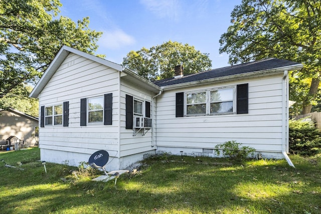 6885 N 315 E, Howe, IN 46746 - view of front of house with a chimney, cooling unit, and a front lawn