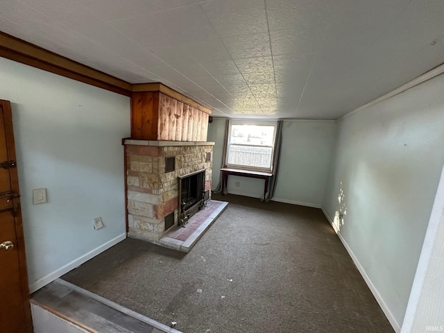 unfurnished living room with a stone fireplace