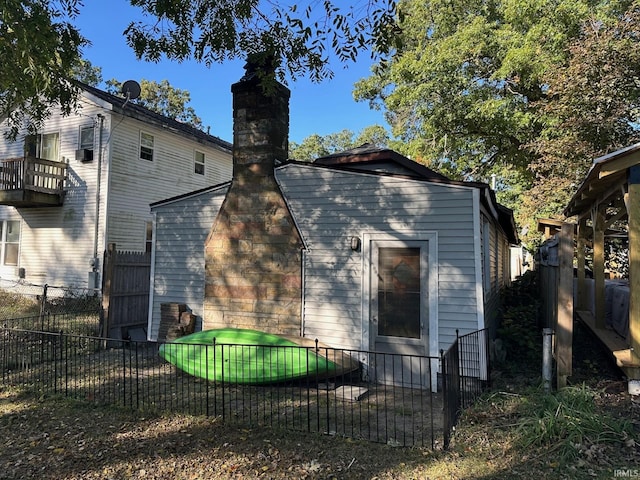 rear view of property with a balcony