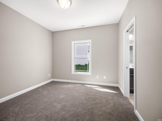 empty room with carpet flooring