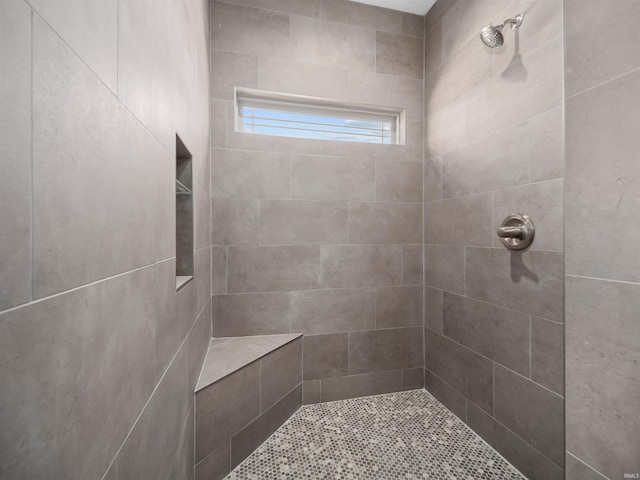 bathroom featuring tiled shower