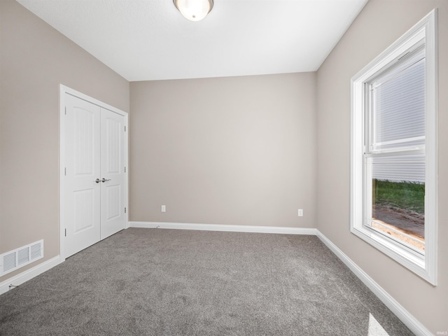 view of carpeted spare room