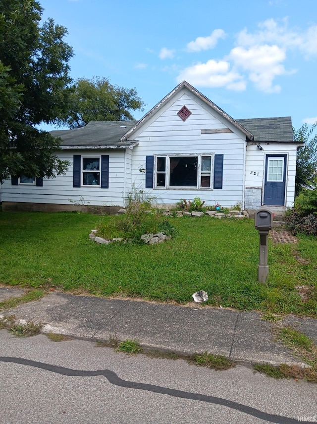 view of front of home with a front yard