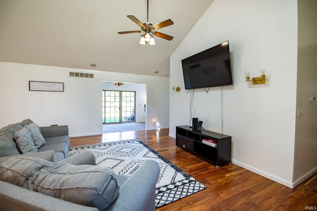 living room with dark hardwood / wood-style floors, high vaulted ceiling, and ceiling fan