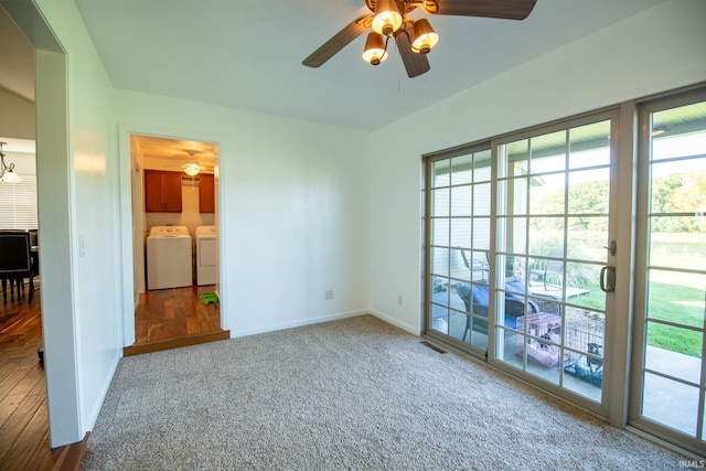 spare room with washer and dryer, ceiling fan, and wood-type flooring