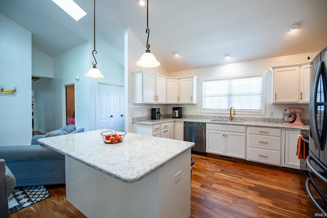 kitchen featuring dishwasher, hanging light fixtures, dark hardwood / wood-style floors, and white cabinetry