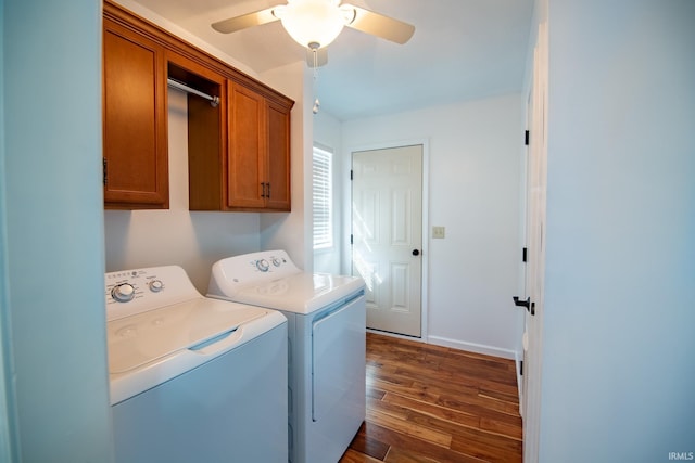 laundry area with washing machine and dryer, dark hardwood / wood-style floors, cabinets, and ceiling fan