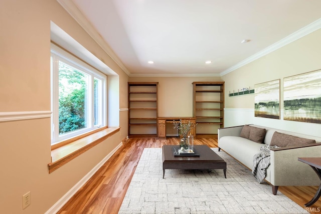 living room featuring hardwood / wood-style flooring and ornamental molding