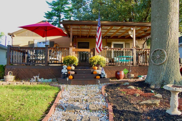 view of front facade featuring a wooden deck