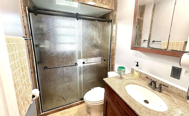 bathroom with an enclosed shower, hardwood / wood-style flooring, vanity, and toilet