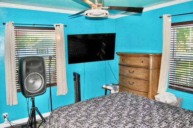 bedroom featuring ornamental molding and ceiling fan