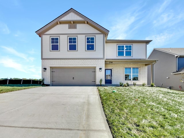 view of front of home with a garage and a front yard