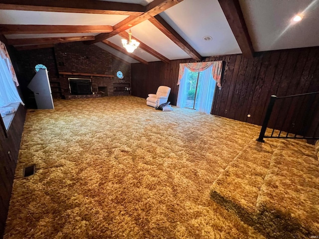 additional living space with a brick fireplace, wooden walls, vaulted ceiling with beams, and carpet floors