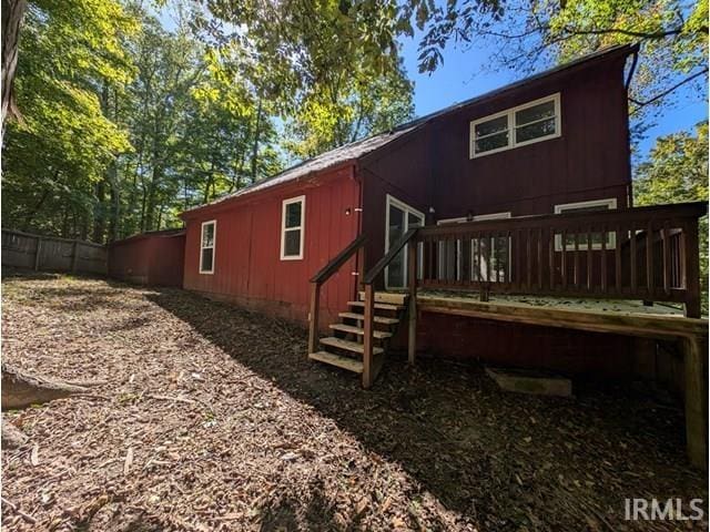 back of house with a wooden deck