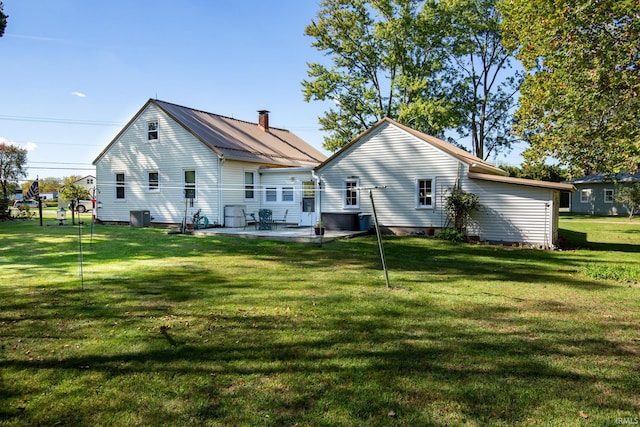 back of house with a patio, central AC, and a yard