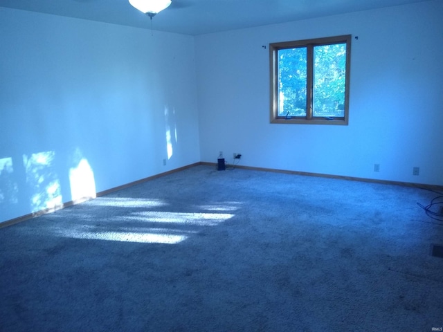 spare room featuring carpet flooring