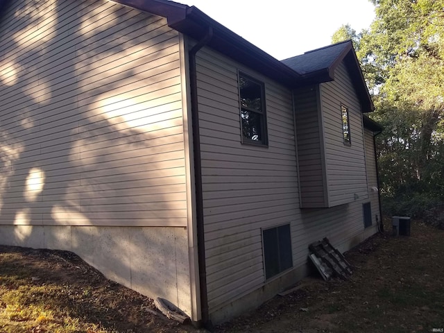 view of side of home featuring central air condition unit