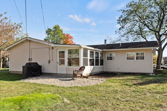 back of house with a yard