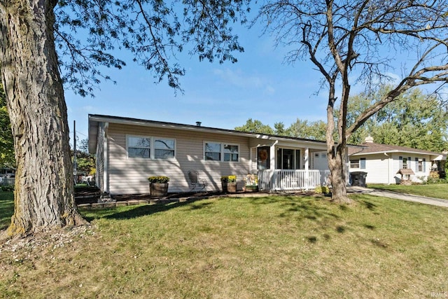 single story home featuring a front yard and covered porch