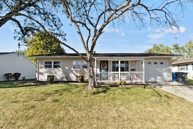 ranch-style home featuring a front lawn, covered porch, and a garage