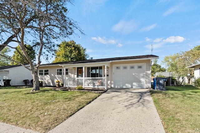 ranch-style house with a garage, a front lawn, and covered porch