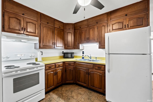 kitchen with ceiling fan, sink, and white appliances