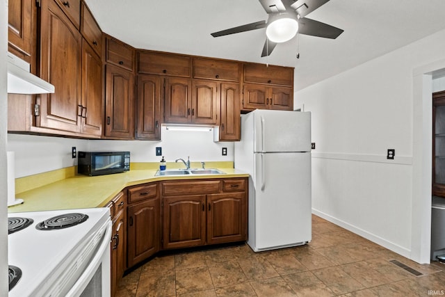 kitchen with ceiling fan, white appliances, and sink