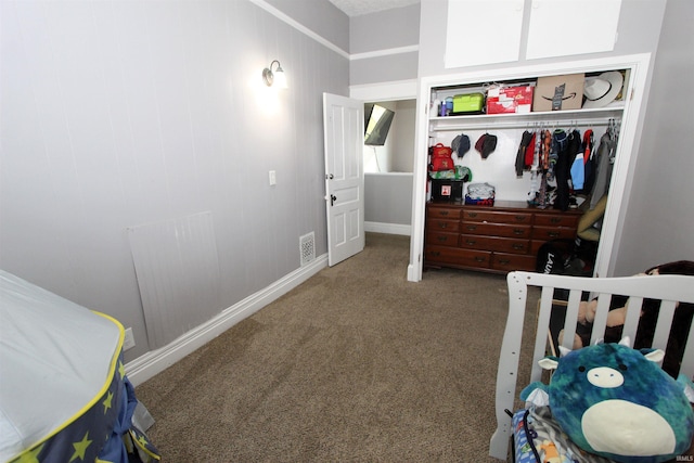 carpeted bedroom featuring a closet