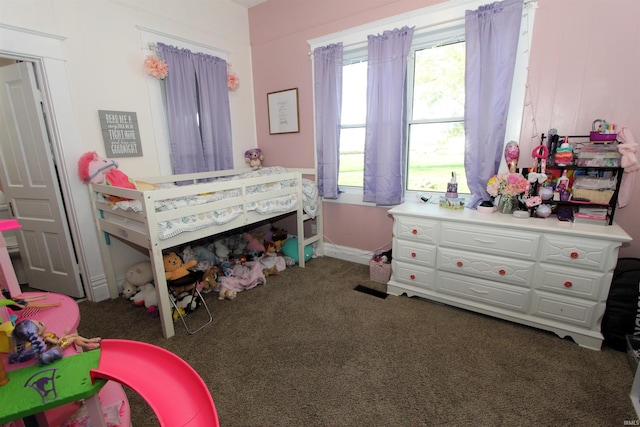 bedroom featuring dark carpet