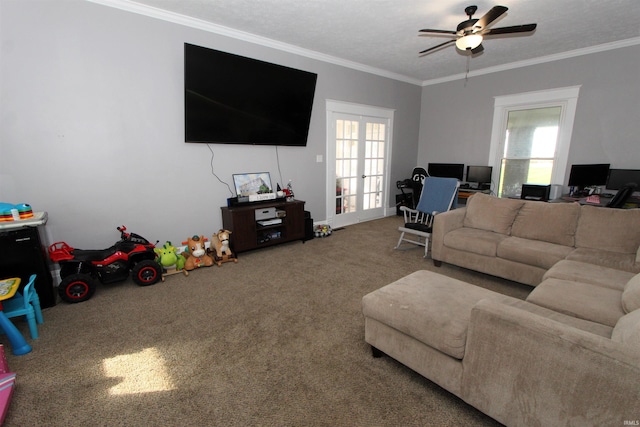 carpeted living room with ceiling fan, plenty of natural light, and ornamental molding