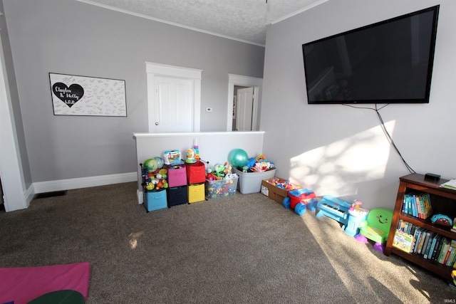 playroom with carpet flooring and a textured ceiling