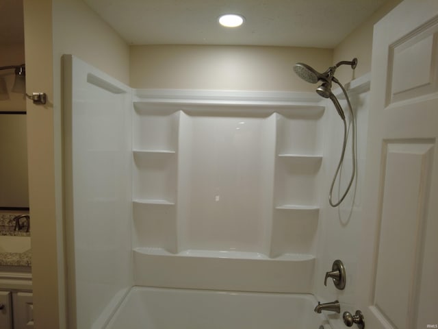 bathroom featuring vanity and shower / tub combination