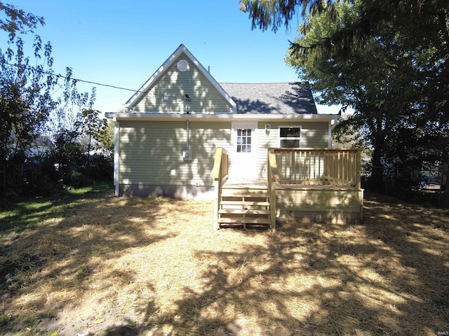 rear view of property with a wooden deck